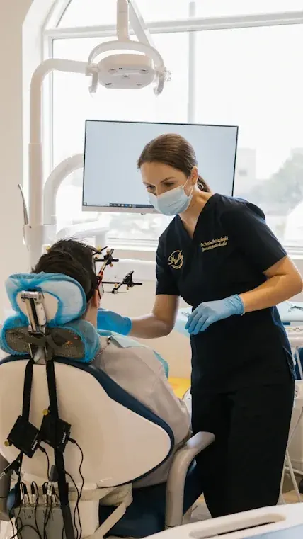 Dr. Svetlana demonstrates condylography for TMJ diagnostics in Dubai